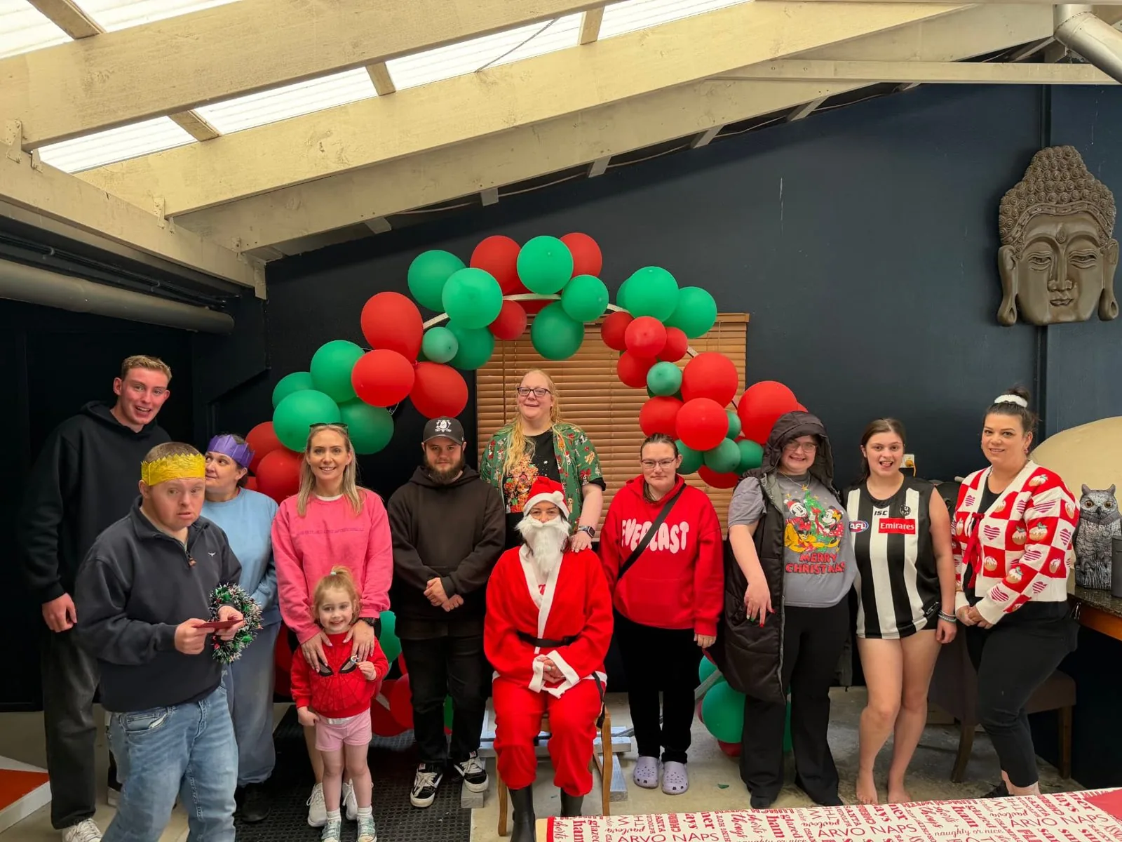 Group photo of participants, families and staff with Santa at the EYSS Christmas party