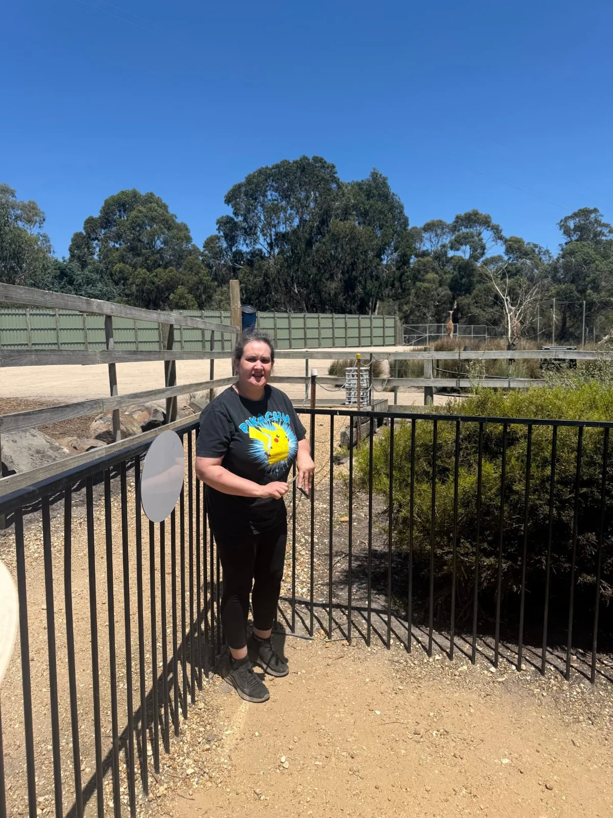 Participant at the wildlife park enclosure on a sunny day