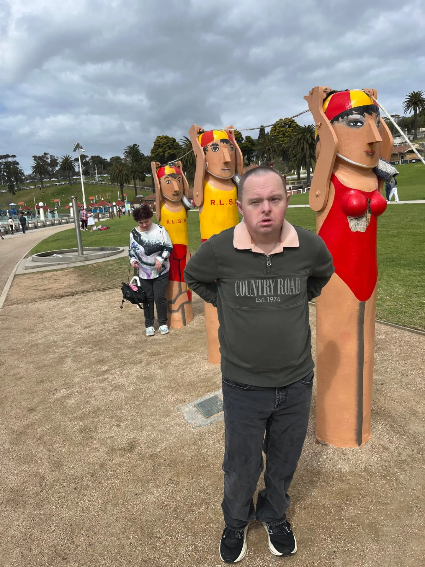 Participants beside the painted bollards on the Geelong waterfront